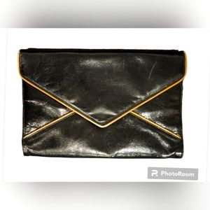 Black Envelope Clutch with Gold piping and Removable Straps.